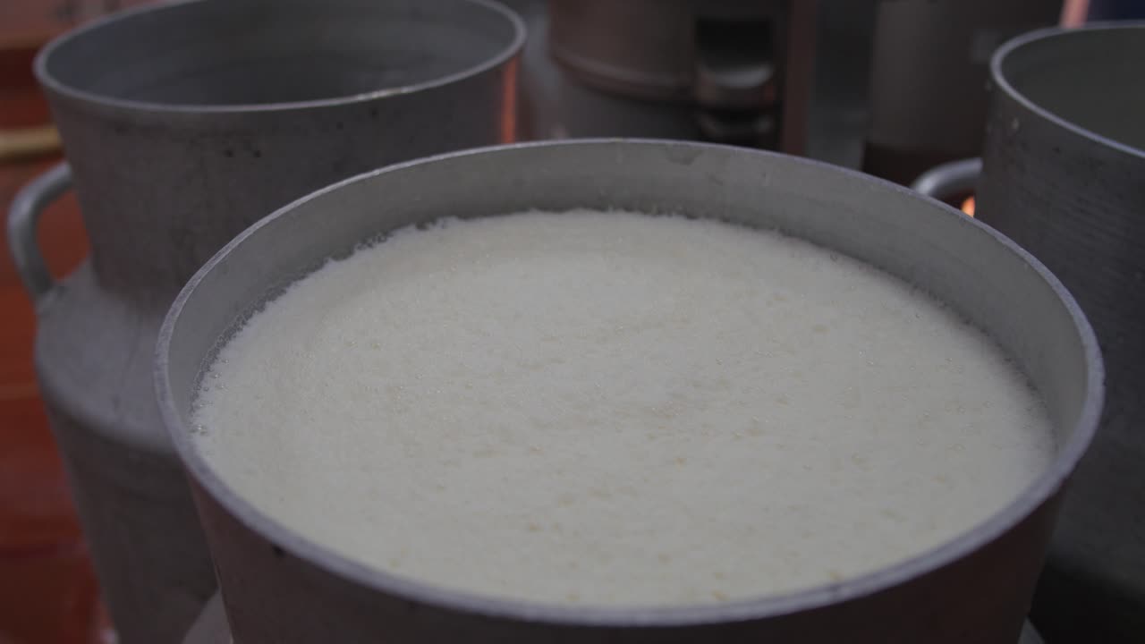 Fresh liquid milk in a container for raw materials for making cheese at factory