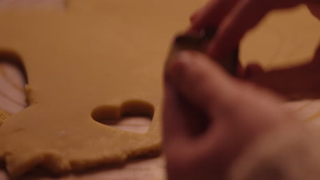 child making heart-shaped cookies