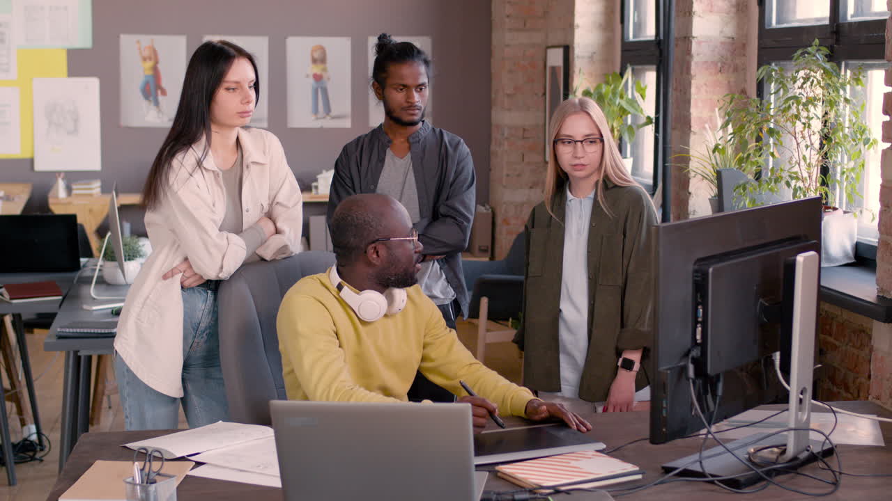 Multiethnic Team Of Graphic Designers Working Together In An Animation Studio 12