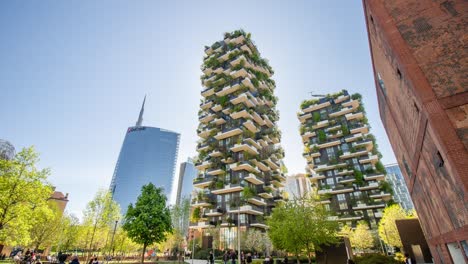 vertical forest built against high-rise glass buildings