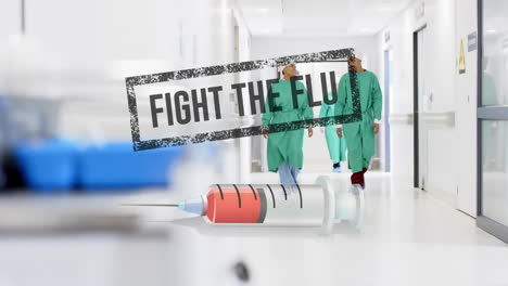 Animation-of-fight-the-flue-text-and-syringe-over-diverse-surgeons-in-hospital