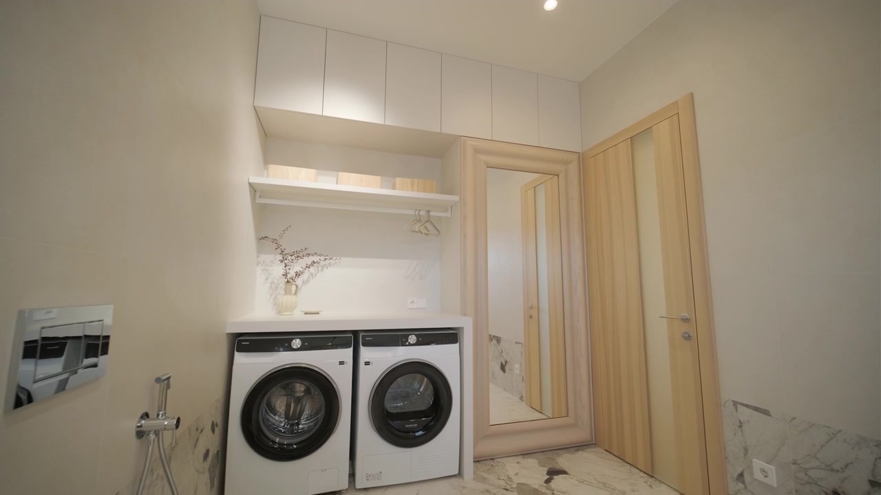 Modern Laundry Room Interior with Washing Machine and Dryer