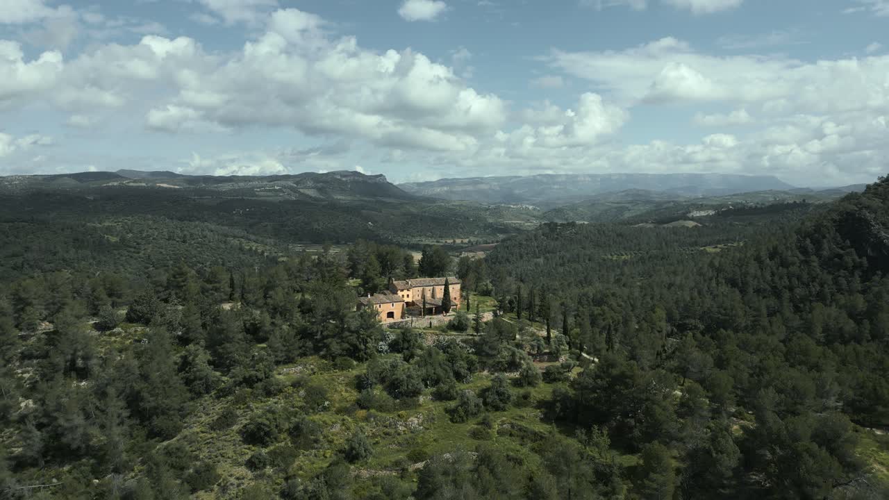 Picturesque view of the catalan hermitage mare de deu de pinyeres, nestled amidst the serene landscape of el priorat, catalonia, showcasing the tranquil beauty of the region