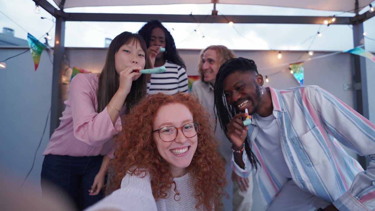 Friends celebrating at a rooftop party