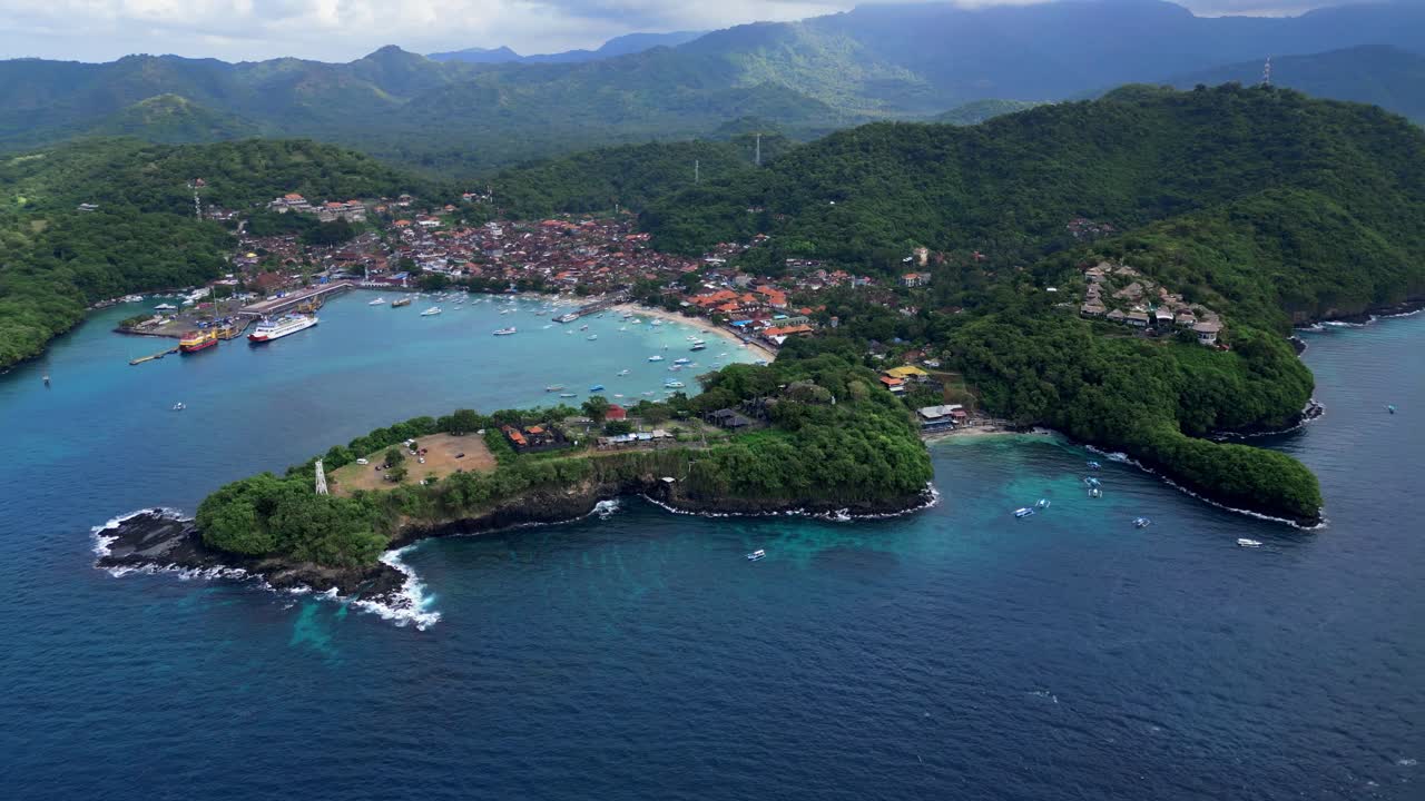 Orbital drone view of the Blue Lagoon and Padang Bai in Bali