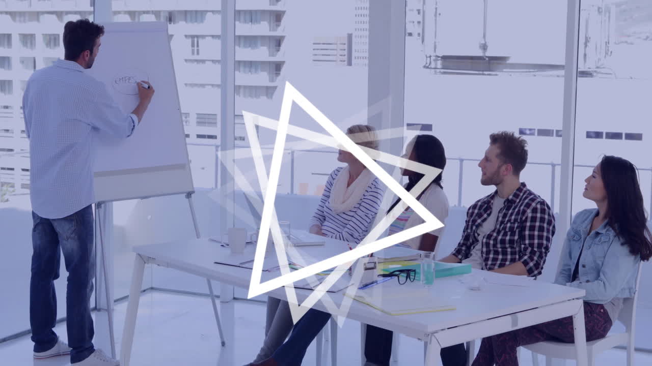 Presenting at office meeting, man using triangle animation overlay on screen