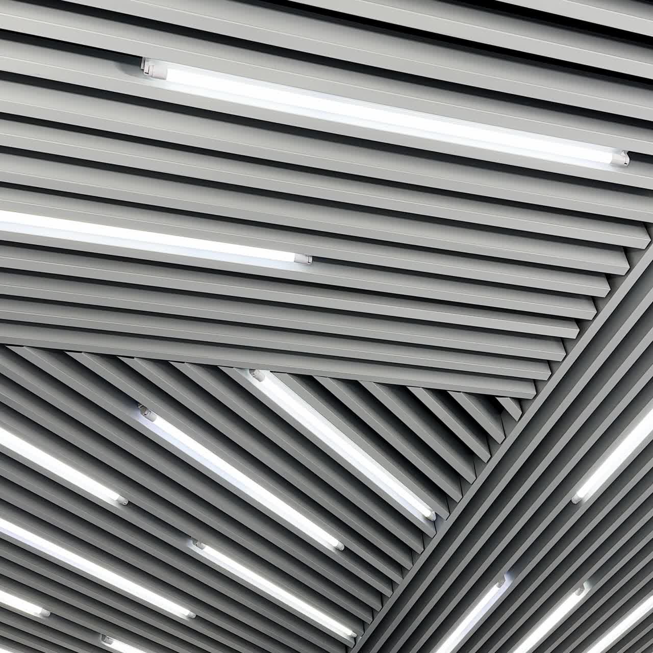 Lamps of day light switched on the ceiling. Long led illumination equipment black and white video. Low angle view