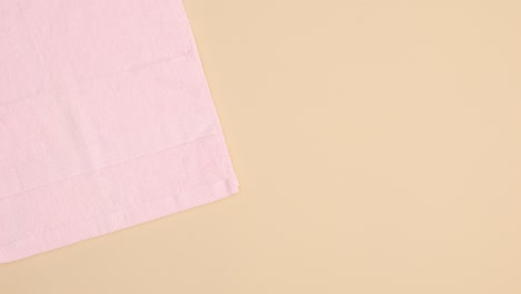 beauty skin care spa products appear on beige background with pink towel. stop motion