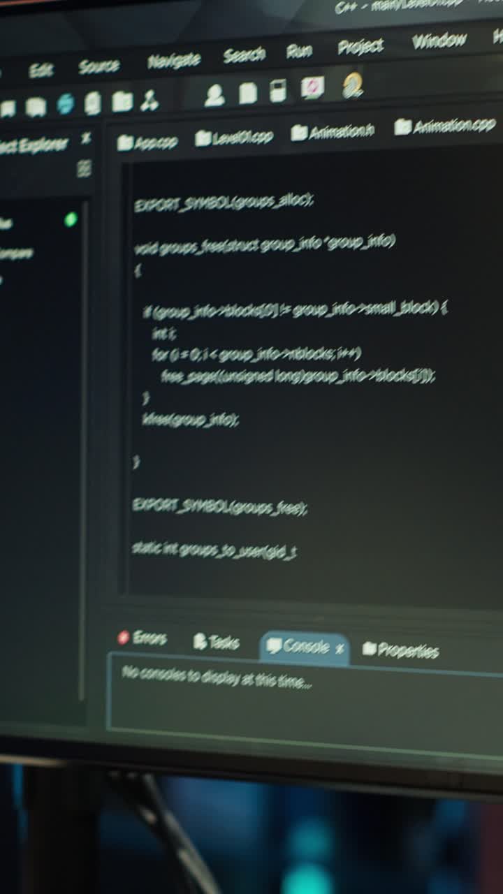 Vertical video Programmer typing on computer to fix software vulnerabilities, close up