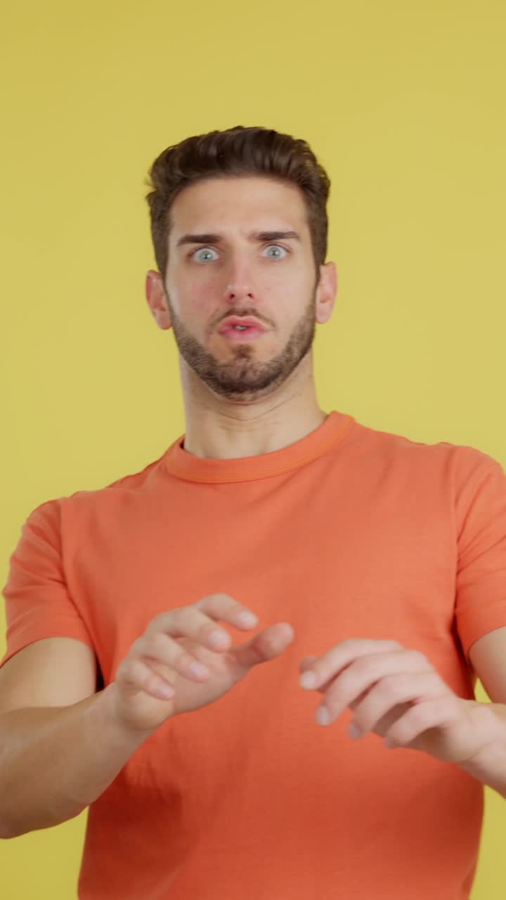 Man with wide eyes reacting with surprise or shock