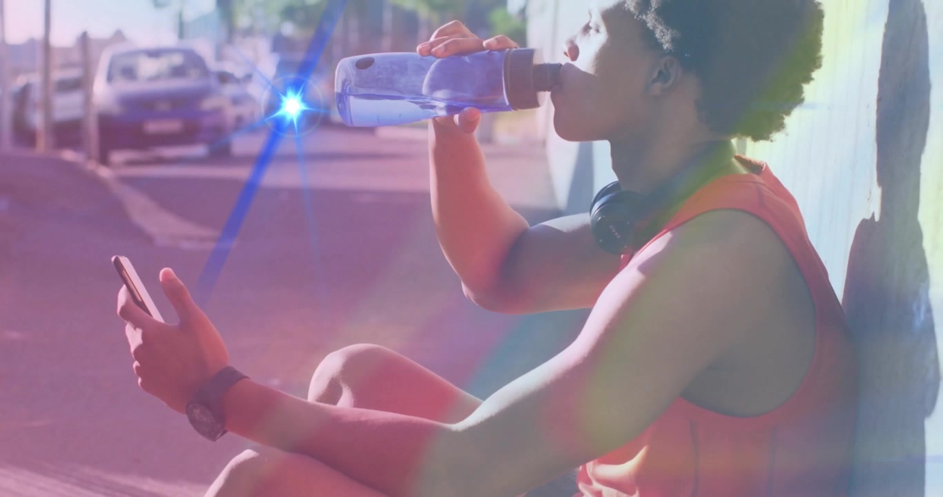 Man drinking water and checking smartphone on urban sidewalk, with animated fitness graph overlay