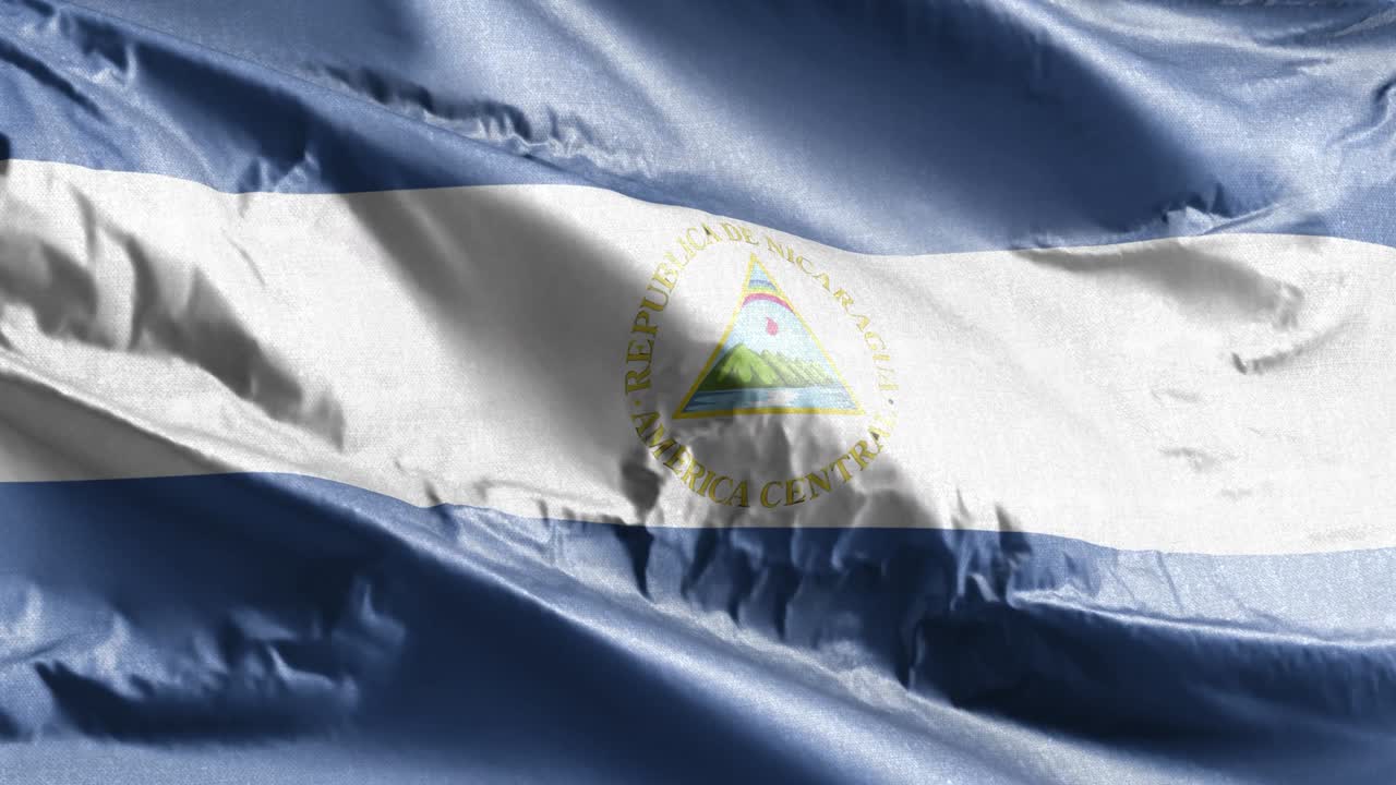 Nicaragua textile flag waving on the wind loop. Nicaragua banner swaying on the breeze. Fabric textile tissue. Full filling background. 10 seconds loop.