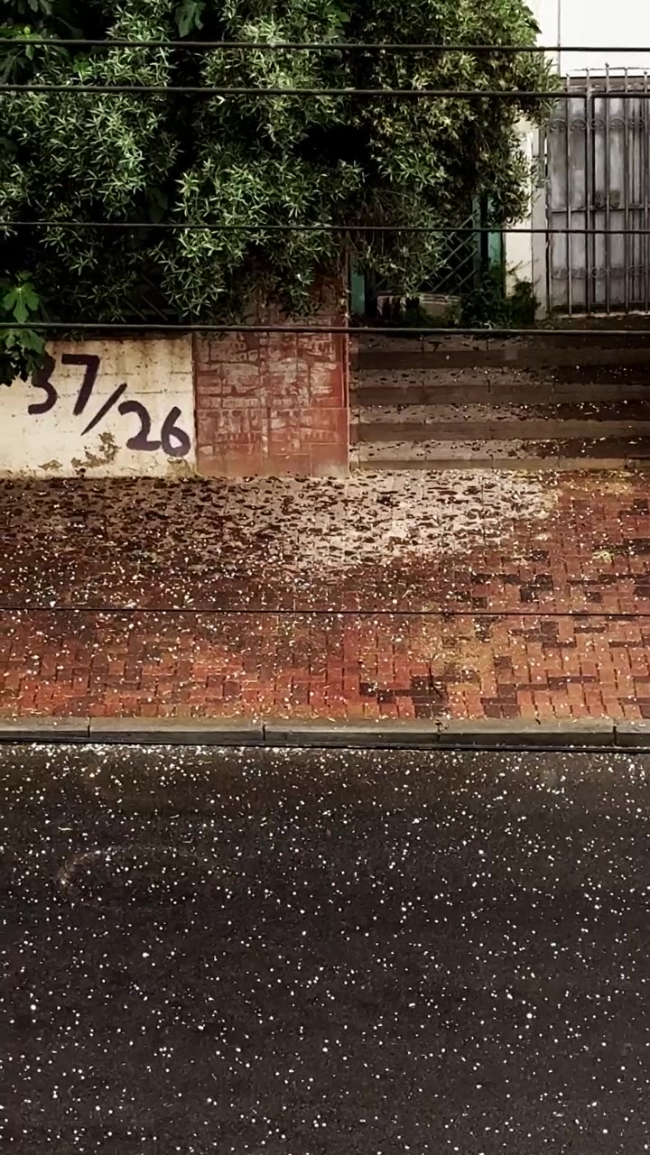 City street experiencing cold hail storm weather