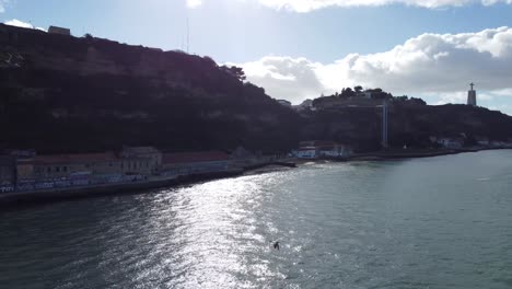 flying a drone next to a flock of seagulls over the river tejo in lisbon portugal