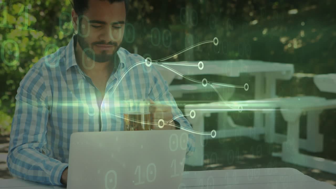 Man opening laptop and typing for data analysis, activating binary overlay then sipping beer