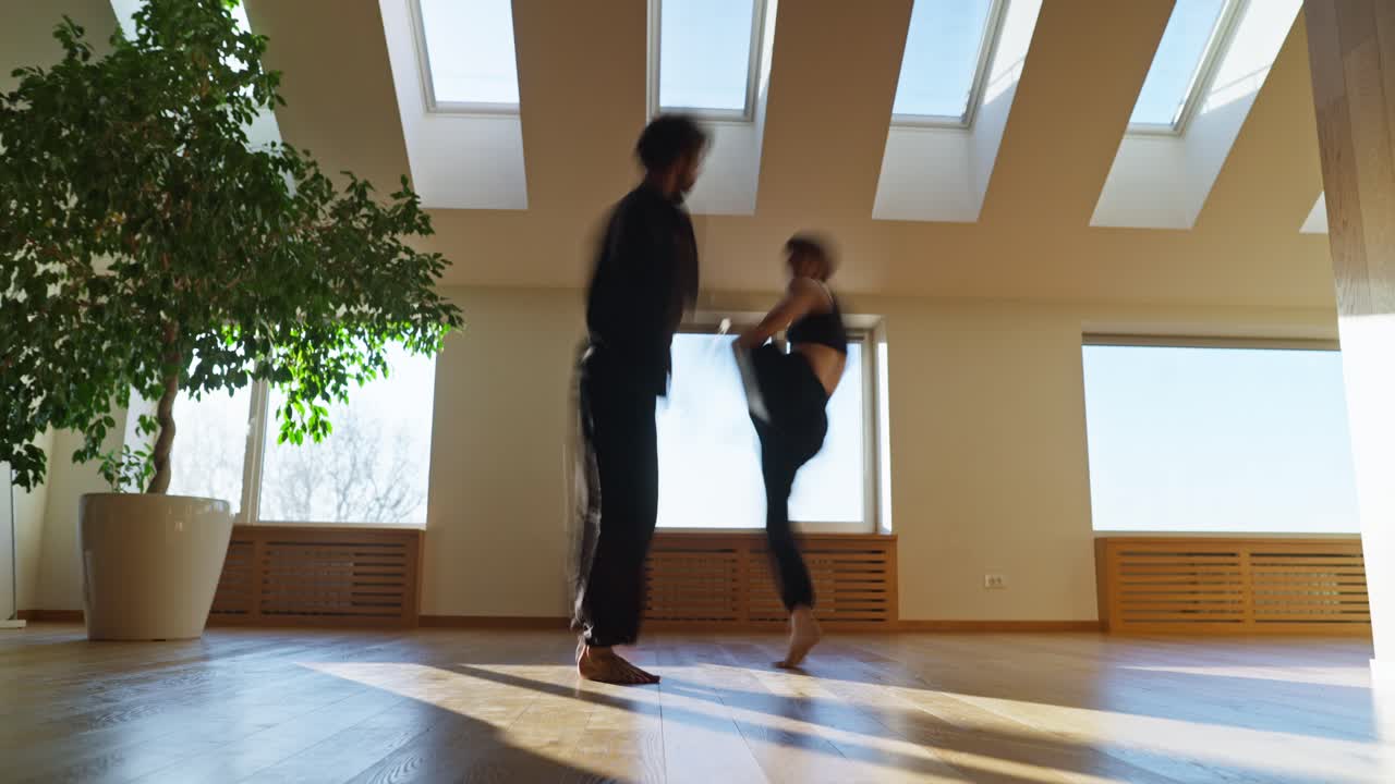 A woman is doing a cartwheel in a room