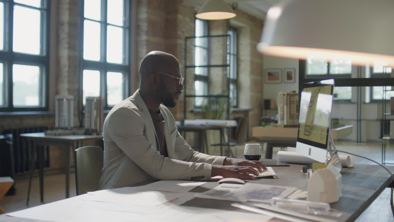 Architect working on a computer in a modern office