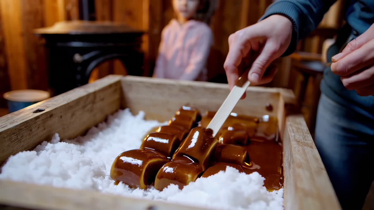 Making Traditional Maple Taffy on Snow at a Sugar Shack