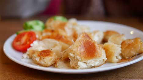 plate of turkish cheese pastry with salad