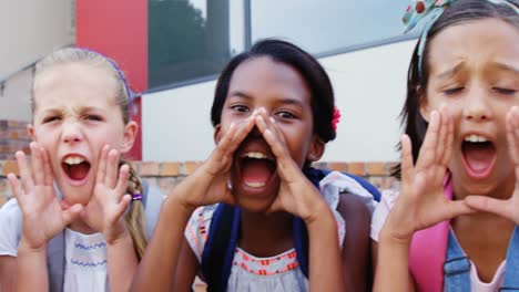 Group-of-kids-shouting-and-screaming-at-school-staircase