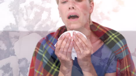 animation of ill woman wearing blanket sneezing into tissue, over macro virus