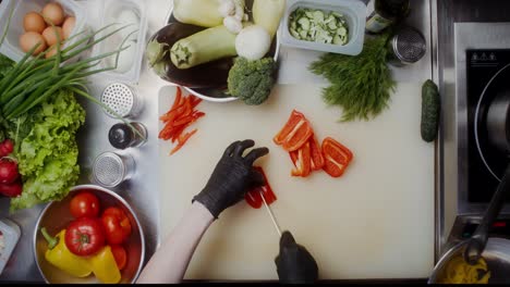 chef chopping red peppers