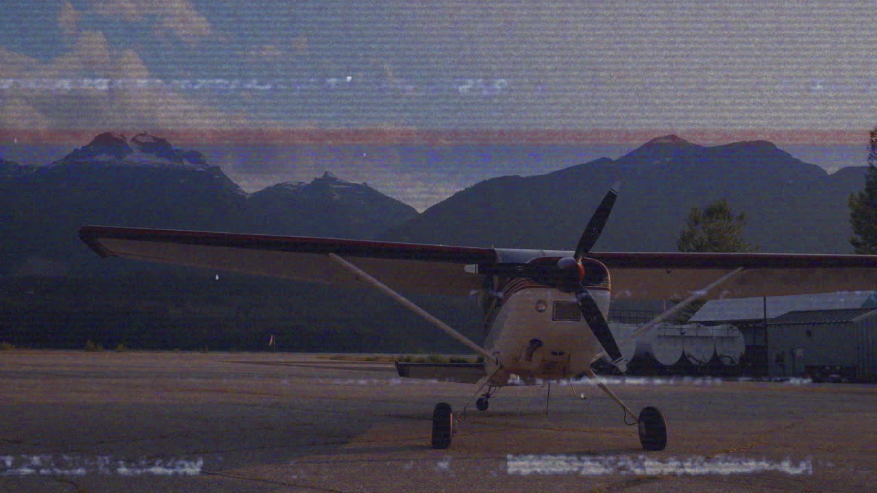 Airplane parked on tarmac with mountains in background, ready for animation