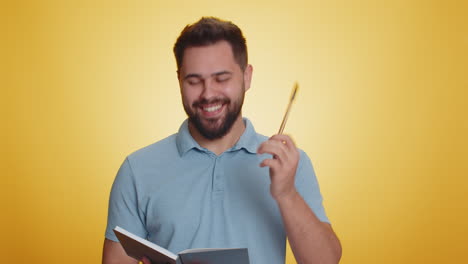 man making notes writing down thoughts with pen into notepad notebook diary to do list good idea