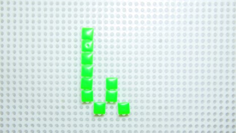 stop motion of the letter w creating one pixel at the time, made with children toys