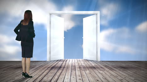 door opening to blue sky watched by businesswoman