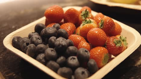 strawberries in a bowl with other berries