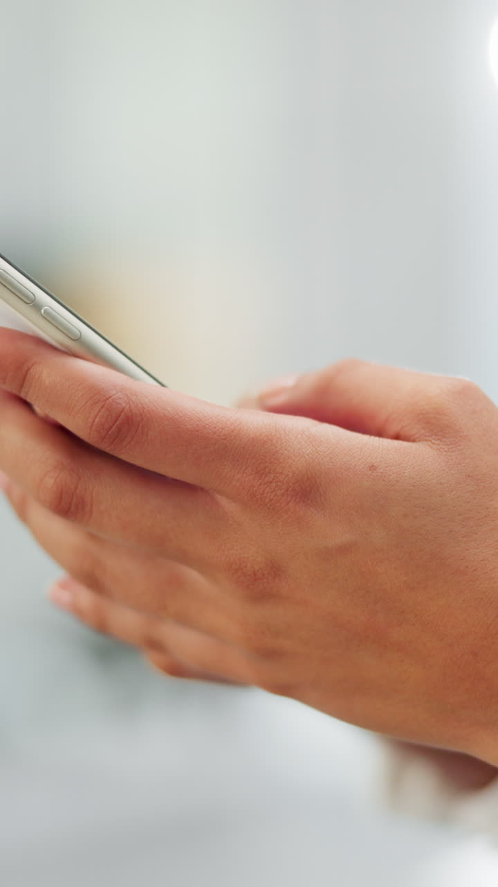 Close-up of Hands Typing and Scrolling on a Smartphone