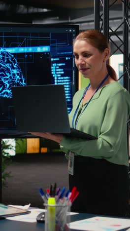 vertical video female entrepreneur works with neural networks for analytics