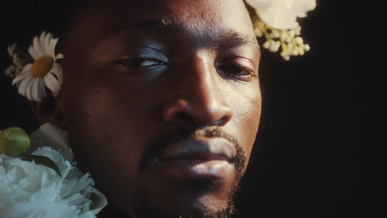 Close-Up Portrait of Handsome Black Man with Flower Wreath
