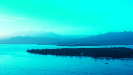 Glowing-seascape-with-blue-azure-colors-of-sun-shining-over-tropical-island-surrounded-by-calm-sea-surface-in-Bali