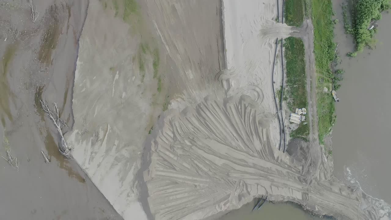 Aerial view straight down of repaired river levee