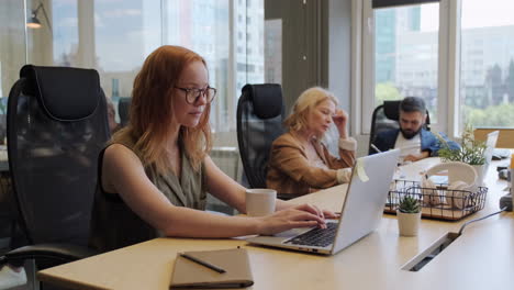 people working in open space office