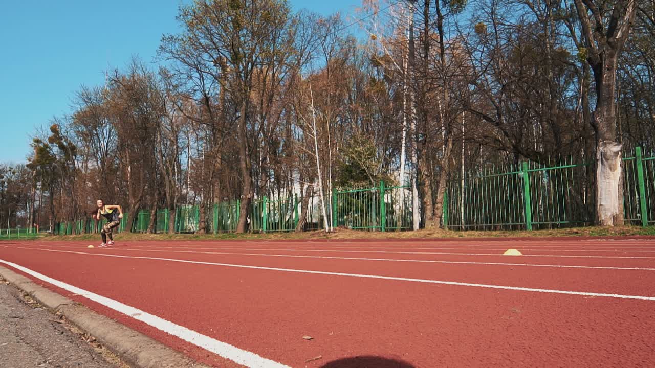 Runner athlete doing exercises at the stadium. Sports shoes. Healthy Lifestyle