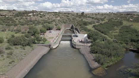 High-flow-river-comes-from-underground-pipeline,-power-dam-outflow