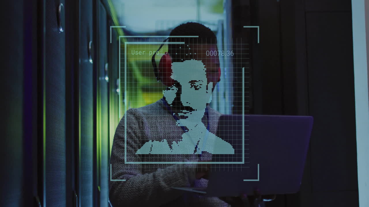 animación de fotos biométricas y técnico afroamericano masculino usando computadora portátil en la sala del servidor