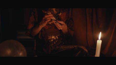 A gypsy lady shuffles the tarrot cards