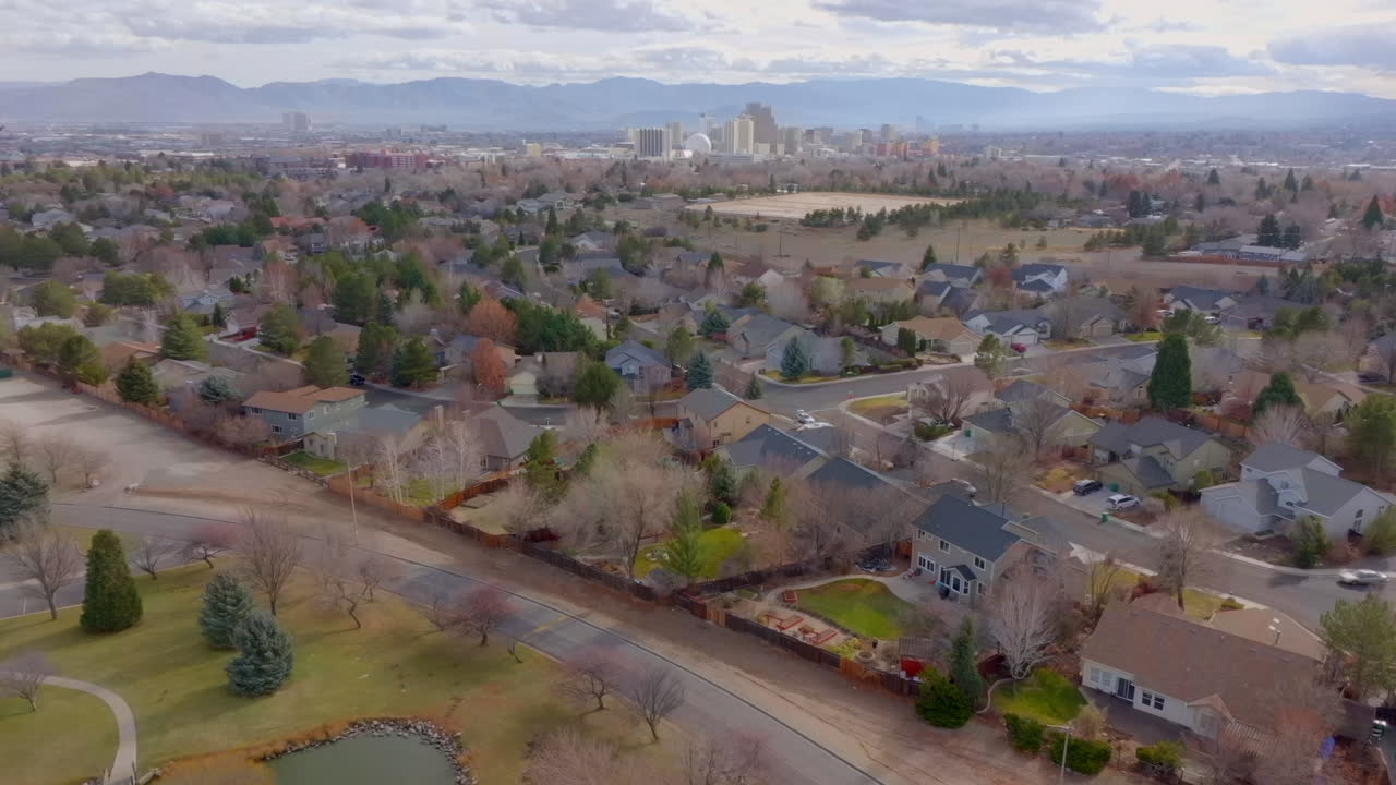 Aerial of residential neighborhood in Reno Nevada with city skyline on the horizon