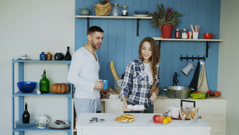 couple enjoying a sweet breakfast in the kitchen