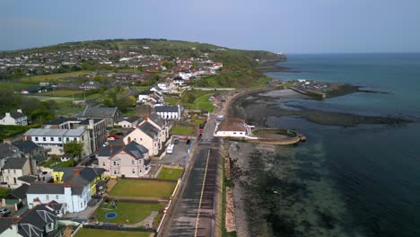 Aerial-shot-of-Whitehead,-a-seaside-village-in-Co