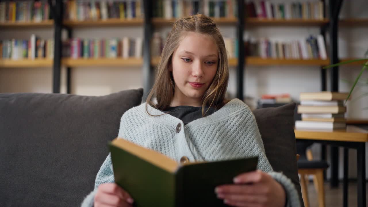 Teenage Girl Reading in a Library