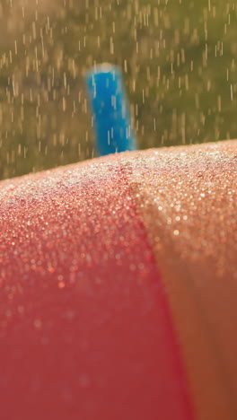 raindrops descend on parasol surface. stylish and vibrant parasol stands as steadfast shield offering protection to owner. unfavorable weather