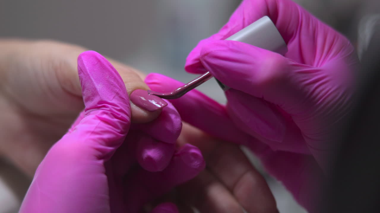 Manicure with pink gloves