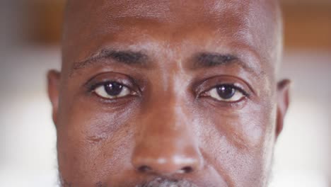 Portrait-of-happy-senior-african-american-man-spending-time-in-log-cabin,-slow-motion