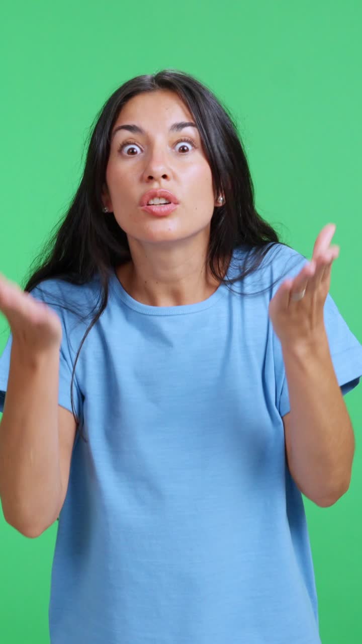 Angry woman arguing and gesturing on a green screen