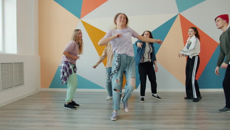 teenagers dancing in a dance studio